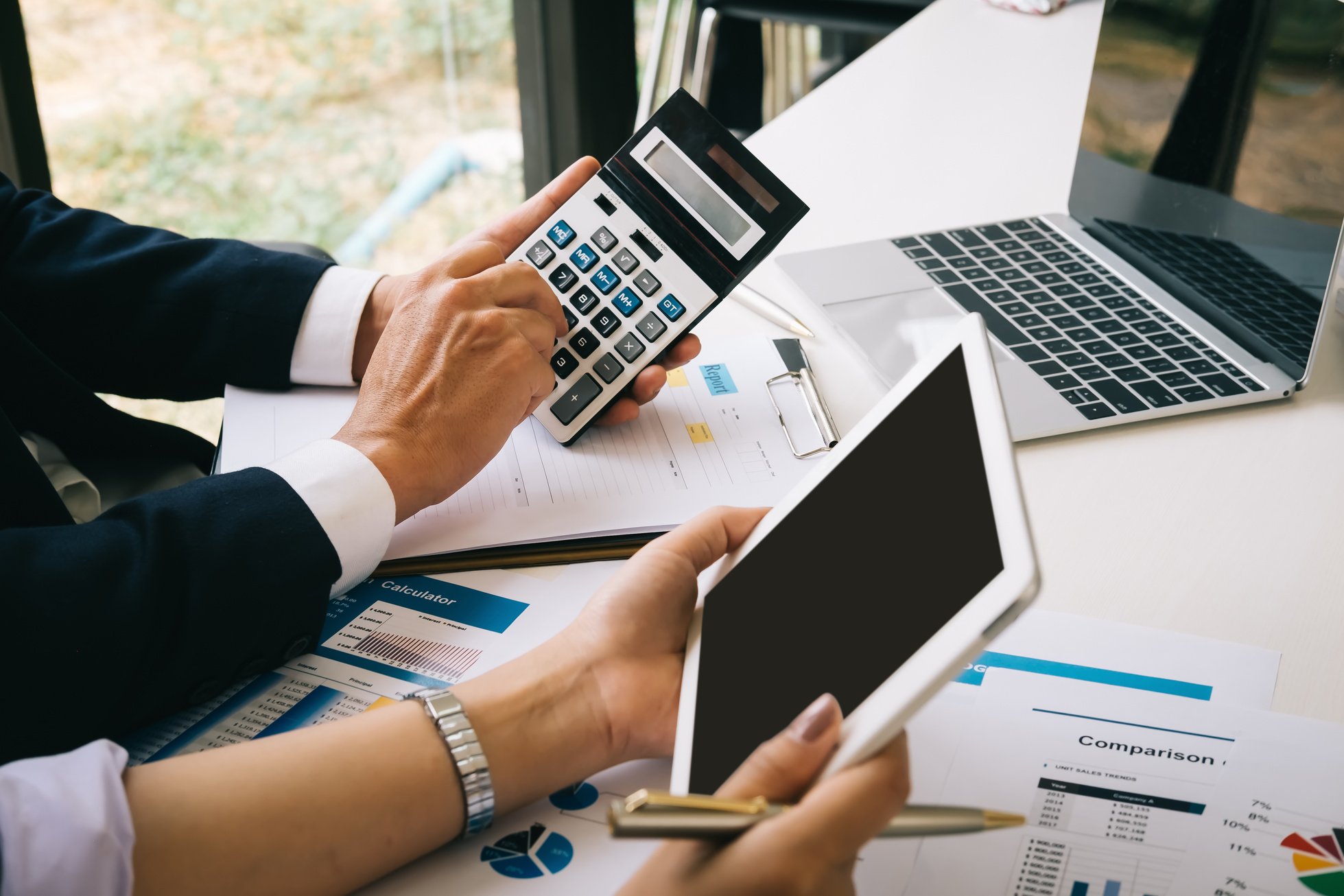 Business People Calculating the Business Expenses